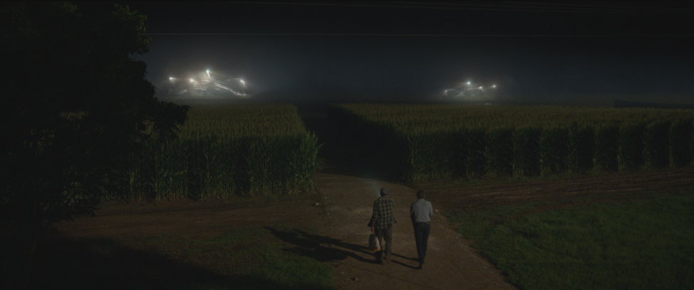 A holdout farmer and the Wolverine observe autonomous mega-threshers farming syrup corn. Logan (2017). In a screenshot from the movie Logan, a holdout farmer and the Wolverine observe autonomous mega-threshers farming syrup corn.